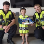 PC Kassim and PC Wright presented James with a toy helicopter