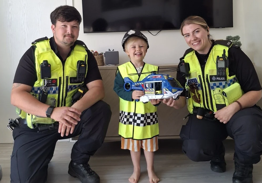 PC Kassim and PC Wright presented James with a toy helicopter